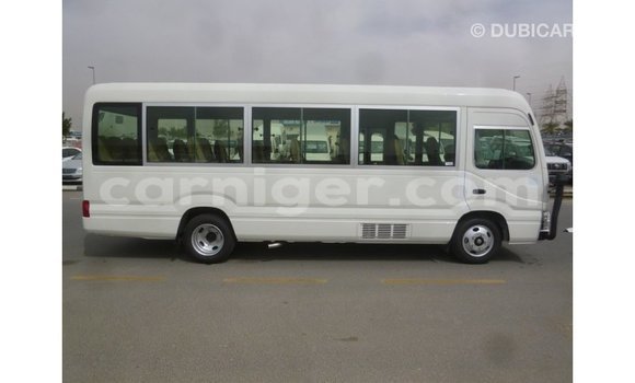 Sayi Imported Toyota Coaster White Mota in Import - Dubai a Agadez Sayi Imported Toyota Coaster White Mota in Import - Dubai a Agadez