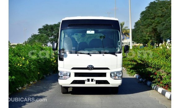 Sayi Imported Toyota Coaster White Mota in Import - Dubai a Agadez Sayi Imported Toyota Coaster White Mota in Import - Dubai a Agadez