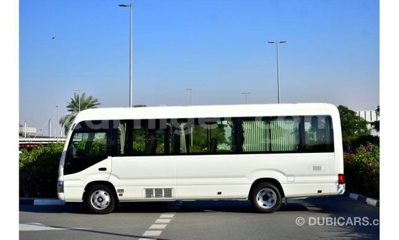 Sayi Imported Toyota Coaster White Mota in Import - Dubai a Agadez Sayi Imported Toyota Coaster White Mota in Import - Dubai a Agadez