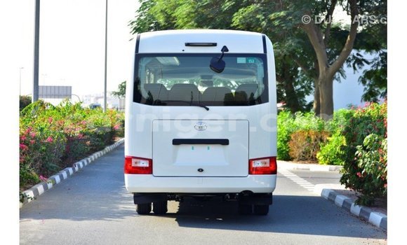 Sayi Imported Toyota Coaster White Mota in Import - Dubai a Agadez Sayi Imported Toyota Coaster White Mota in Import - Dubai a Agadez