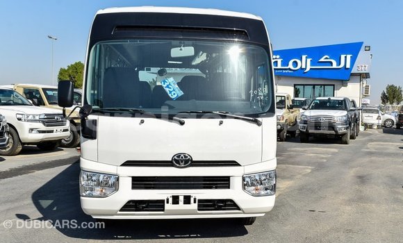 Sayi Imported Toyota Coaster White Mota in Import - Dubai a Agadez Sayi Imported Toyota Coaster White Mota in Import - Dubai a Agadez