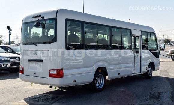 Sayi Imported Toyota Coaster White Mota in Import - Dubai a Agadez Sayi Imported Toyota Coaster White Mota in Import - Dubai a Agadez