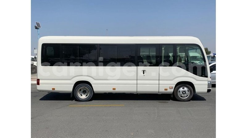 Big with watermark toyota coaster agadez import dubai 6444