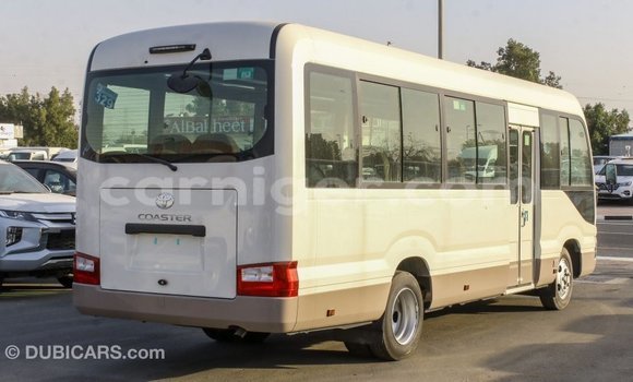 Sayi Imported Toyota Coaster White Mota in Import - Dubai a Agadez Sayi Imported Toyota Coaster White Mota in Import - Dubai a Agadez