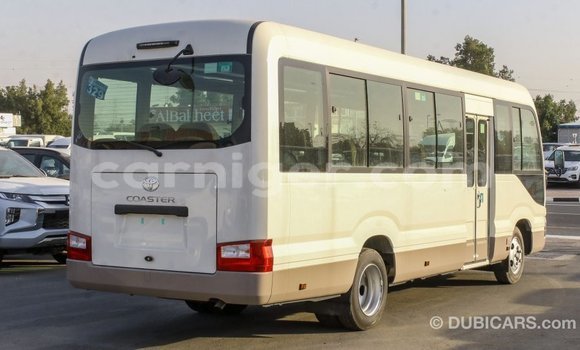 Sayi Imported Toyota Coaster White Mota in Import - Dubai a Agadez Sayi Imported Toyota Coaster White Mota in Import - Dubai a Agadez