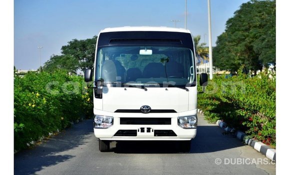 Sayi Imported Toyota Coaster White Mota in Import - Dubai a Agadez Sayi Imported Toyota Coaster White Mota in Import - Dubai a Agadez