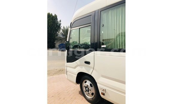 Sayi Imported Toyota Coaster White Mota in Import - Dubai a Agadez Sayi Imported Toyota Coaster White Mota in Import - Dubai a Agadez