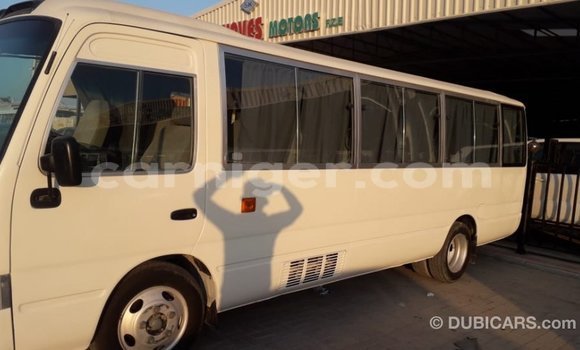 Sayi Imported Toyota Coaster White Mota in Import - Dubai a Agadez Sayi Imported Toyota Coaster White Mota in Import - Dubai a Agadez